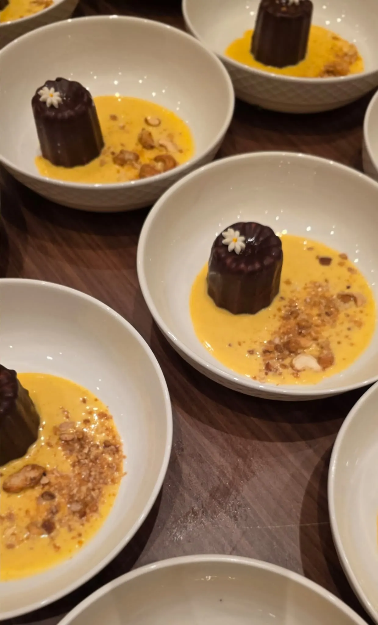 Chocolate canelés with sabayon