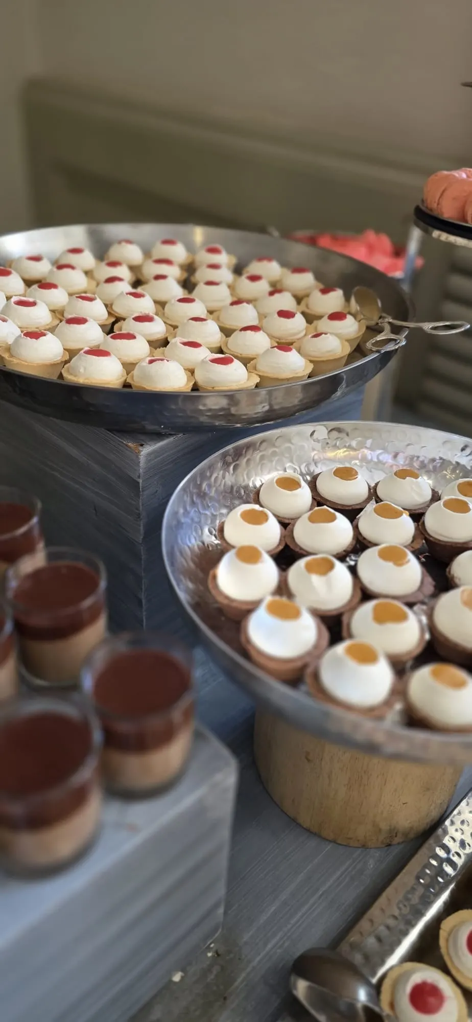 Cream tartlets with berry and caramel centers